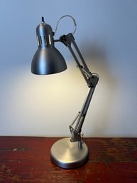 Brushed Chrome Articulating Desk Lamp.