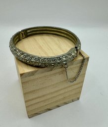 Silvertone Cuff With Crystals And Safety Chain