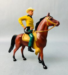 Cowboy On Brown Horse With Lasso