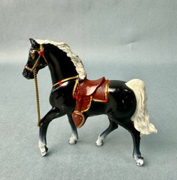 Small Black Metal Horse With Brown Saddle
