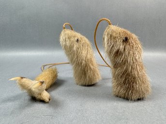 2 Fur Animals Attached To A Fur Claw With Cord