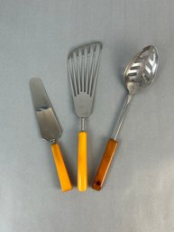 Three Amber Bakelite Serving Utensils