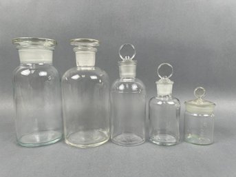 5 Vintage Medicine Bottles With Glass Stoppers.