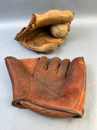 2 Vintage Baseball Gloves.
