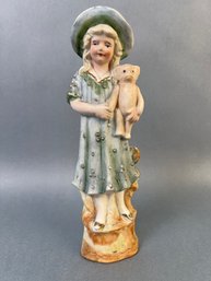 Vintage Bisque Figurine Of Girl With A Teddy Bear Made In Germany.