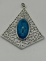 Silver Tone Pendant With Large Blue Stone