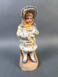 Bisque Porcelain Girl In Winter Wear With Doll.