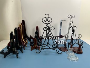 18 Different Stands, Mostly Plate Stands, 1 Doll And Some Picture Stands. Local Pick Only