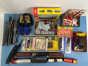 Lot Of N Scale Train Pieces Including An Engine, 6 Cars, 2 Transformers, Track And Accessories.