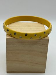 Yellow  Plastic Bracelet Embedded With Cut Glass