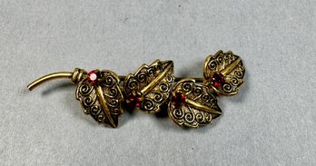 Gold Tone Pin With Red Stones