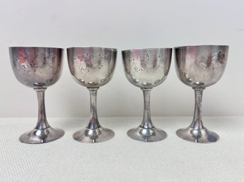 4 Sterling Silver Saki Cups.