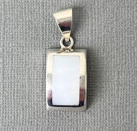 Sterling Silver And White Stone Pendant.