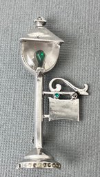 Sterling Silver Lamppost Brooch With Green And Clear Stones.