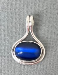 Sterling Silver Pendant With Blue Stone.