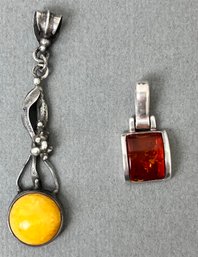 2 Sterling Silver And Amber Pendants.