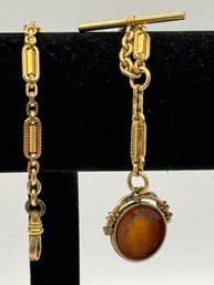 Gold Tone Fob With Translucent Amber Imprint On Pendant