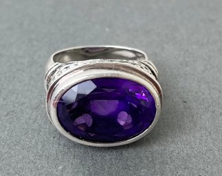 Sterling Silver Bezzeled Oval Purple Stone Ring