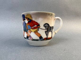 Teacup Featuring Children With Toys.