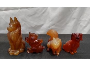 4 Amber Color Figurines