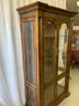 Four Door Carved Curio Cabinet With Glass Shelves