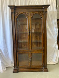 Four Door Carved Curio Cabinet With Glass Shelves