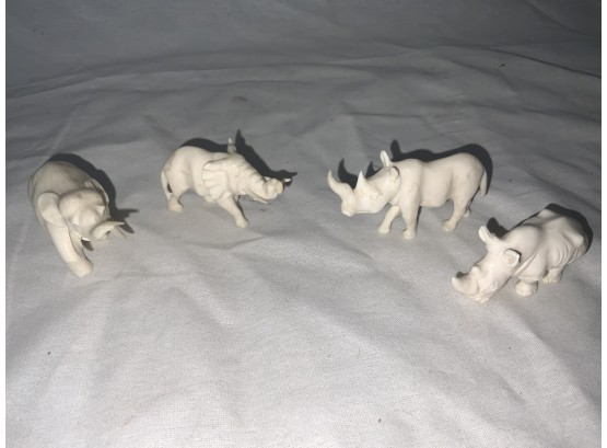 4 Carved Elephants And Rhinos