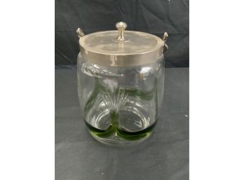 Clear Jar. With Green Wave Like Art Leading To Cut Class.