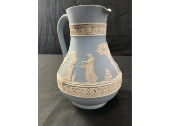 Wedgwood Pitcher W/Raised Figures. Some Wear.