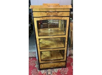 Burled Wood Curio With Black Accents And Mirrored Back