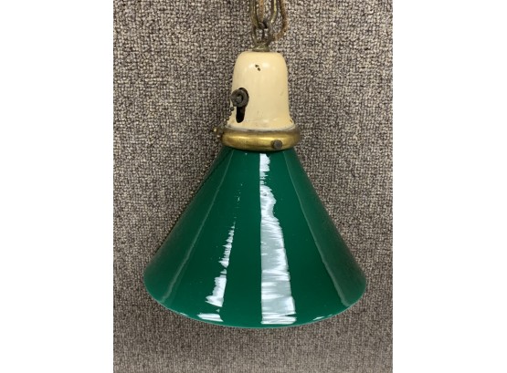 Green Vintage Hanging Fixture With A Green And White Shade