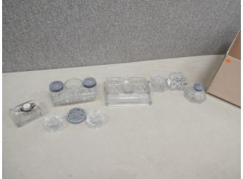 A Collection Of Glass Inkwells Of Various Sizes