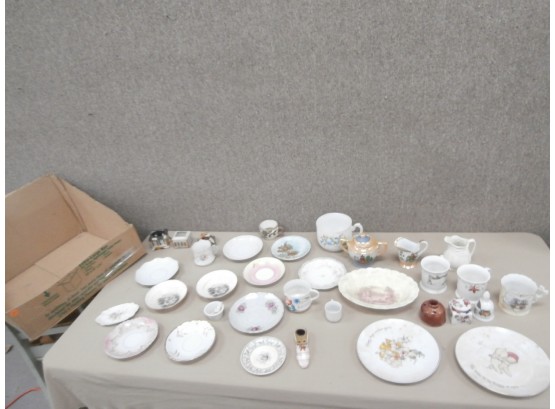 An Assortment Including 2 Kewpie Plates, Lusterware, Saucers, Victorian Era Mugs And Others