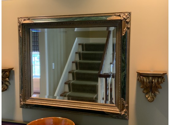 Gold And Marbleized Frame With A Beveled Mirror