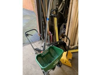 Shovels, Broom, Squeegee, Lawn Spreader, And A Snow Rack
