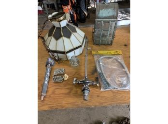 An Assorted Lot Including A Sink Hose, Belt Buckles, 2 Lights And A Beer Tap