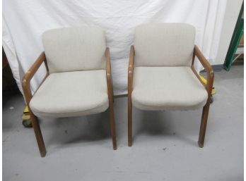 A Pair Of Upholstered Armchairs With Oak Frames