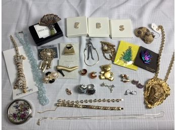 An Assorted Lot Of Jewelry Including Pins, Necklaces, Earrings And Rings