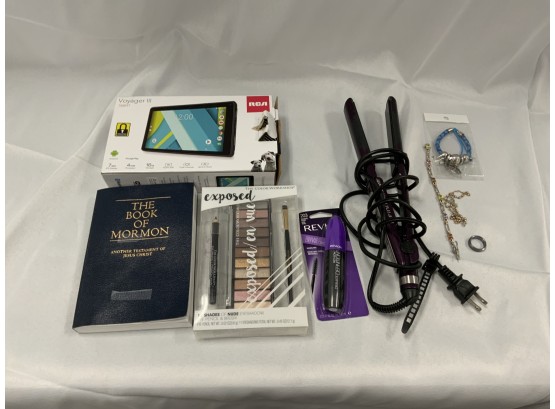 Miscellaneous Lot Including A Flat Iron, RCA Tablet, Make-up, Book Of Mormon