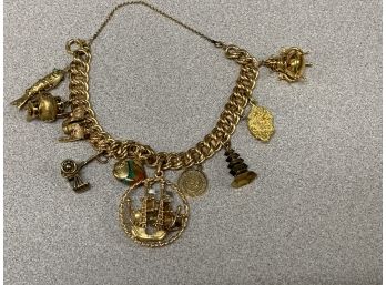 18Kt Charm Bracelet With 18K,14K,and10K Charms 49.7 Grams