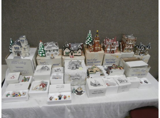 17 Piece Grouping Of Dept. 56 Snow Village Series Including Buildings And Accessories