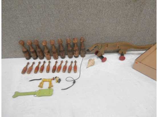 Wooden Toy Lot Including Pins, Dog Pull Toy And Fisher Price Pluto Pop Up Kritter Paddle Toy And Top