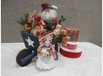 An Assorted Lot Including Santa With Gifts, A Folk Art Wheel Barrow, Lady Peddler With Basket, Etc.