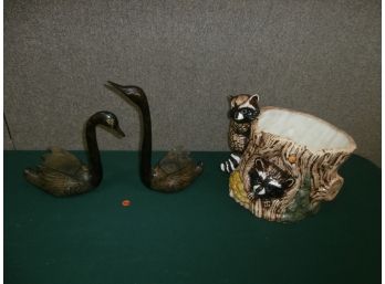 Home Decor Including A Pair Of Metal Swans And A Ceramic Tree Stump Shaped Planter With Raccoons