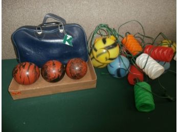 3 Bocce Balls With Case And A String Of Decorative Tiki Style Plastic Lights