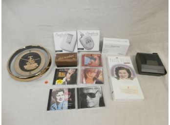 CD's Including Patsy Cline, Simplicity By Ultratec Alert, Polaroid Camera And A Seiko Quartz Wall Clock, Etc.