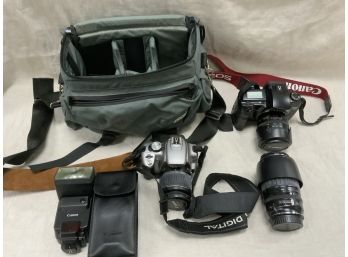 2 Canon EOS Model Cameras With Lenses
