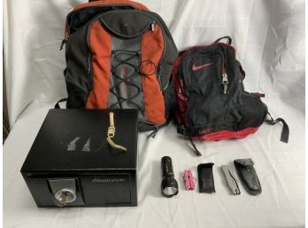Assorted Lot Including All In 1 Tools, Backpacks And A Safe With A Key, Etc.
