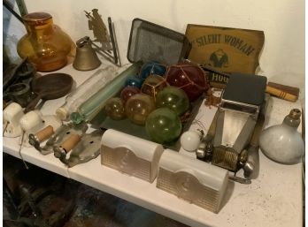 Shelf And Table Lots Including Cookware, Home Decor, Figural Bell, Cast Iron, Glass Ball Buoys, Etc.