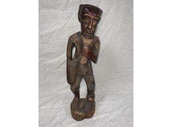 A Carved Wooden Man Statue
